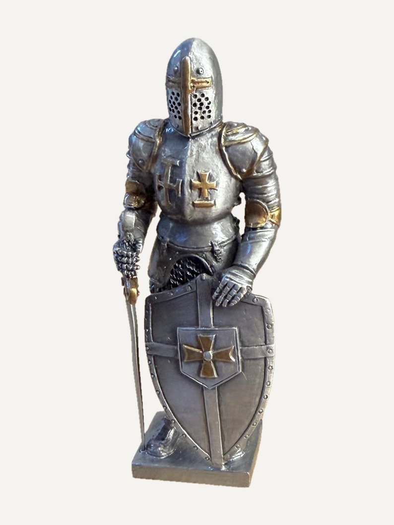 Pewter figurine of a knight in plate armour: closed helm with a gold-tone cross on the visor, two crosses on the breastplate, one of them gold-tone, left hand on a shield marked with a cross, sword point-down at his side