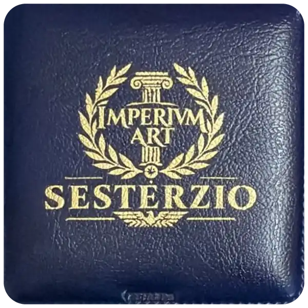 Blue Imperivm Art case, closed. On the lid, in gold: a column, a laurel wreath, the words IMPERIVM ART, the word SESTERZIO and an eagle. Real photo.
