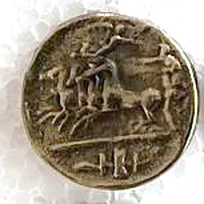 Modern replica of a Greek decadrachm of Syracuse (not a sestertius), the quadriga: A quadriga galloping left, a flying Victory above the driver and arms below the line; no legible letters. Indicative photo of the replica on sale in the shop, gold-coloured.