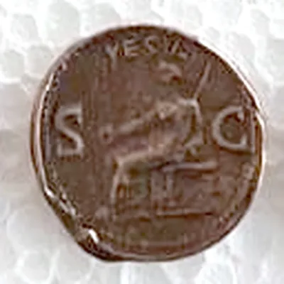 Modern replica of an as of Caligula (not a sestertius), the goddess: Veiled Vesta enthroned with patera and sceptre; VESTA above, S and C either side. Indicative photo of the replica on sale in the shop, bronze-coloured.