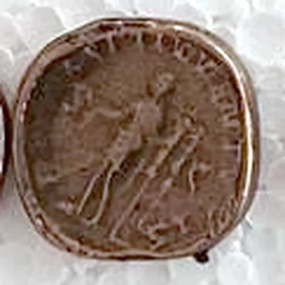 Modern replica of a coin of Maximinus Thrax, the standards: A standing figure beside military standards; the legend above cannot be read. Indicative photo of the replica on sale in the shop, bronze-coloured.