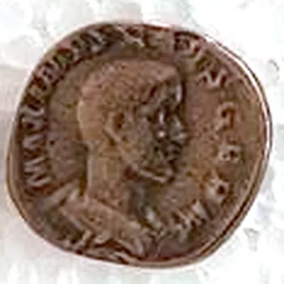 Modern replica of a coin of Maximinus Thrax, the portrait: Bust of Maximinus facing right, hair cropped very short; MAXIMINVS and PIVS AVG can be read, perhaps GERM. Indicative photo of the replica on sale in the shop, bronze-coloured.