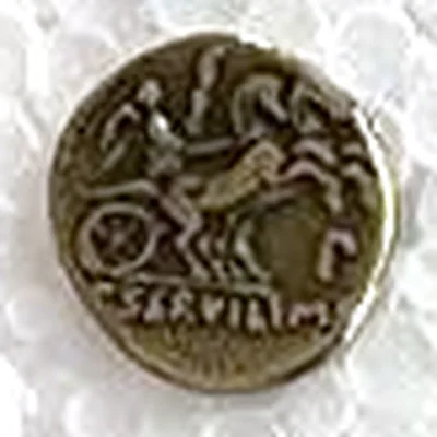 Modern replica of a denarius of the Roman Republic, victory in the biga: Victory in a two-horse chariot, moving right; below, SERVILI M. Indicative photo of the replica on sale in the shop, gold-coloured.