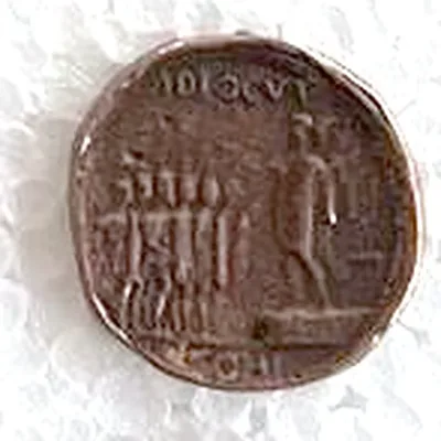Modern replica of a sestertius of Caligula, the scene: The emperor on a platform addresses five soldiers with shields and eagles; ADLOCVT above, COH below. Indicative photo of the replica on sale in the shop, bronze-coloured.