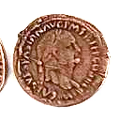 Modern replica of a sestertius of Vespasian, the portrait: Head of Vespasian with a laurel wreath, facing right; CAES VESPASIAN AVG P M TR can be read. Indicative photo of the replica on sale in the shop, bronze-coloured.