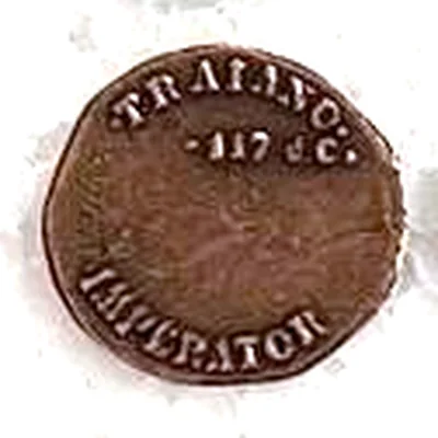 Modern replica of the portrait on a dupondius of Trajan, with a modern side, the modern side: A modern inscription, TRAIANO · 117 d.C. · IMPERATOR: it copies no ancient coin. Indicative photo of the replica on sale in the shop, bronze-coloured.