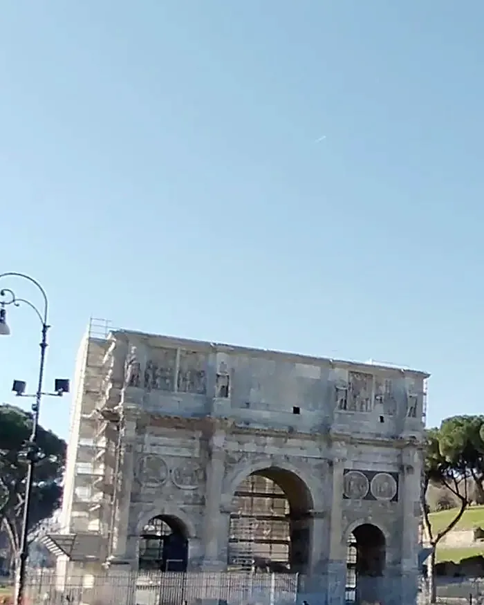 The Arch of Constantine today, with scaffolding on one side, photograph of 6 March 2025.