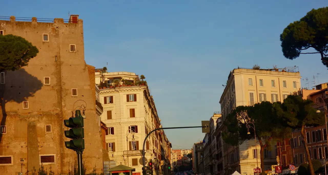 Largo Corrado Ricci: the Torre dei Conti on the left and Via Cavour starting uphill.