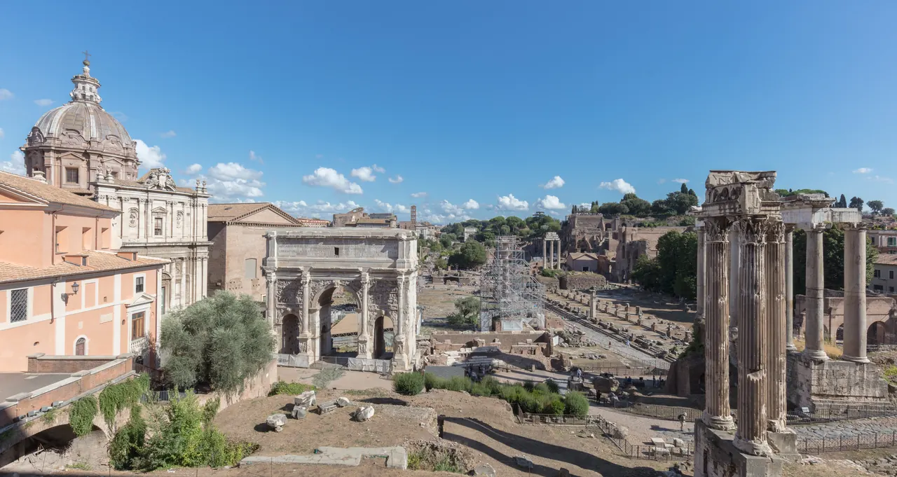 The Roman Forum from the Capitoline Hill: the Arch of Septimius Severus on the left, the columns of the Temple of Saturn on the right, the valley towards the Colosseum beyond.