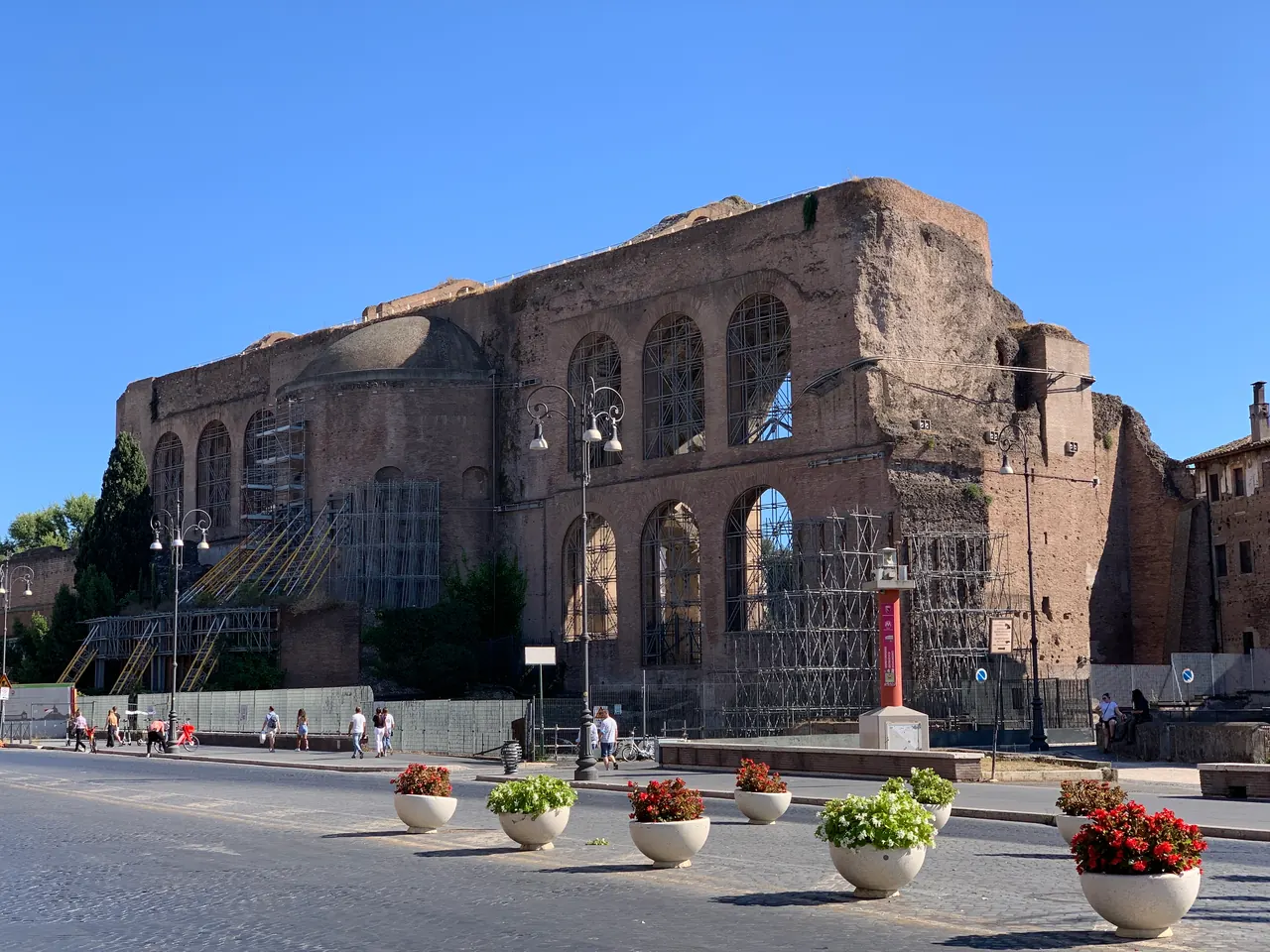 Via dei Fori Imperiali with the Basilica of Maxentius seen from the road.